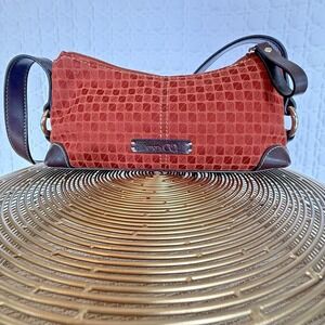 Dainty Nine & Co Geometric concert going rust colored bag